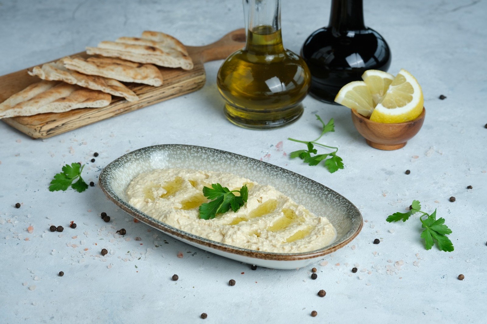 Queb Rooftop - creamy hummus with olive oil and parsley, a light meze before a steak dinner